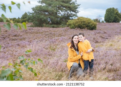 Mother with child on vacation. Single mother with her son in the heathland in Germany 
