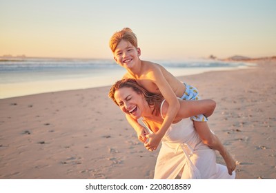 Mother, child and piggy back on beach on summer holiday walking in sea sand. Woman from Australia with son at the ocean. Mom, happy kid and sunset, family time with water, freedom and fun on vacation - Powered by Shutterstock