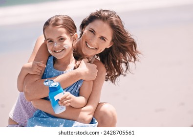 Mother, child and portrait with sunscreen on beach for travel protection in summer for holiday, vacation or weekend. Woman, daughter and hug embrace at ocean in Australia for seaside, relax or safety - Powered by Shutterstock