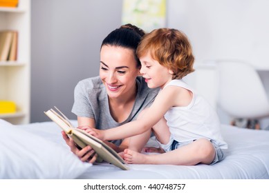 Mother   child reading book