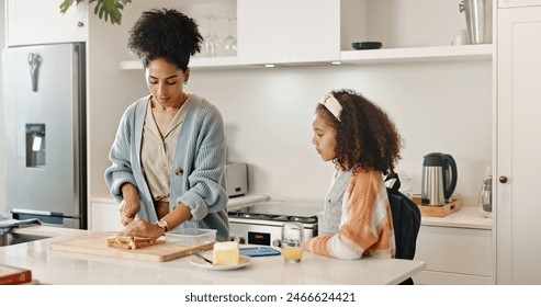 Mother, child and school lunch or sandwich in home cooking or preparing food in morning, nutrition or meal. Woman, daughter and student development with youth snack for wellness, health or kitchen - Powered by Shutterstock
