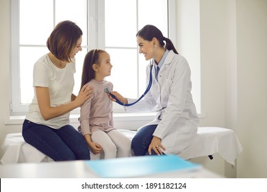 Mother and child seeing family practitioner. Smiling pediatrician with stethoscope checking little girl's lungs. Friendly doctor listening to young patient's breath or heartbeat during medical exam
