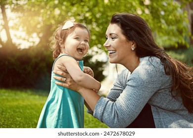 Mother, child and smile with playing in garden for fun activity, bonding or embrace outdoor in home. Happy family, woman or daughter on grass with relax, explore and support with lens flare in nature - Powered by Shutterstock