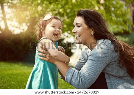 Similar – Image, Stock Photo Mother and child playing with fabric on sunny beach