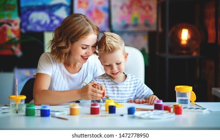 mother   child son  painting draws are engaged in creativity in kindergarten