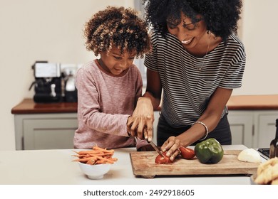 Mother, child and teaching with cooking, skills and nutrition as kids or siblings for education. Young people, woman and helping with development, growth and kitchen counter as family in bonding - Powered by Shutterstock