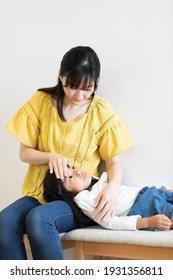 Mother And Child Waiting In The Waiting Room Of The Hospital