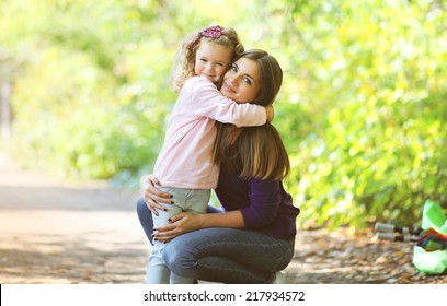 Mother And Child Walking In Park