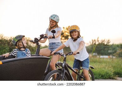 Mother with children cycling in the countryside
 - Powered by Shutterstock