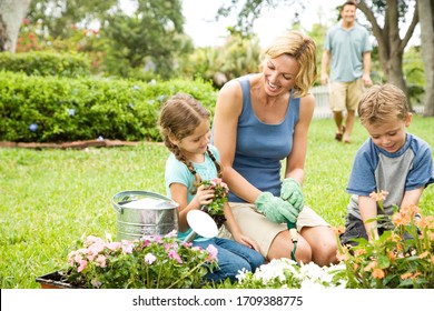 mother and children gardening at home