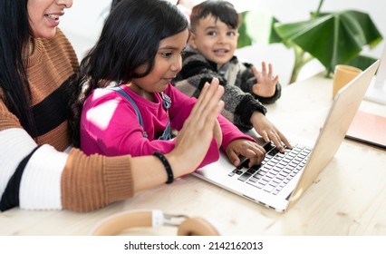 Mother With Children Indian Family Using Computer Video Call