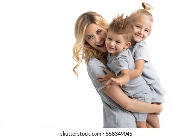 Mother With The Children On A White Background