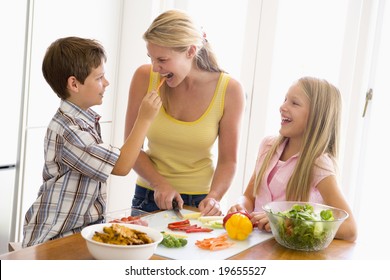 Mother And Children Prepare A meal,mealtime Together - Powered by Shutterstock