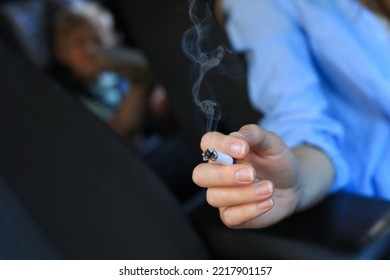 Mother With Cigarette And Child In Car, Closeup. Don't Smoke Near Kids