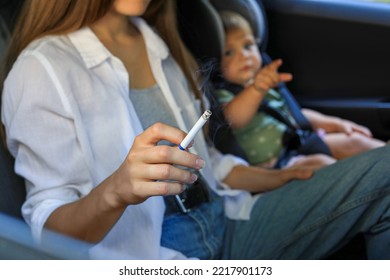 Mother With Cigarette And Child In Car, Closeup. Don't Smoke Near Kids