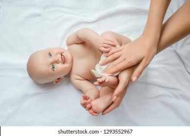 Mother cleaning up and wipes body and leg baby by wet tissue. Cleaning wipe, pure, clean. happy emotions of newborn baby.