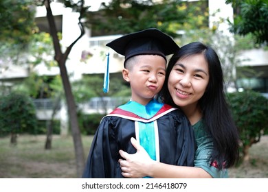 Mother Congratulates Her Child On Graduating From Kindergarten ,Children Graduate, Mom's Love, Parent Hugging Child, Kid Graduation Succeed Concept