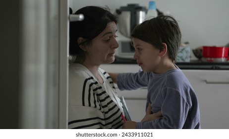 Mother consoling crying hurt little boy, candid tender moment of caring parent giving an empathic hug to upset child struggling with adversity, authentic and real life - Powered by Shutterstock