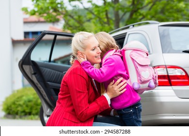 Mother Consoling Daughter On First Day At School, The Kid Being A Bit Afraid Of What May Lay Ahead