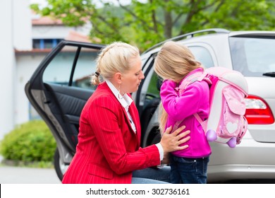 Mother Consoling Daughter On First Day At School, The Kid Being A Bit Afraid Of What May Lay Ahead