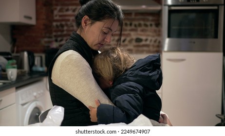 Mother consoling tearful crying baby toddler boy, casual and candid - Shutterstock ID 2249674907