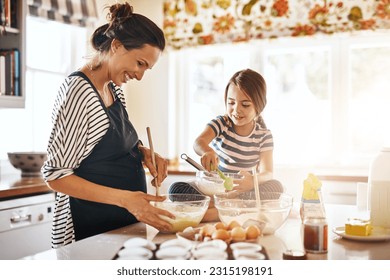 Mother, cooking or happy girl baking in kitchen as a family with a young kid learning cookies recipe at home. Cake pastry, baker or mother helping or teaching daughter to bake for child development - Powered by Shutterstock