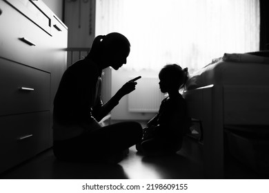 Mother correcting disciplining her little child toddler at home. Parenting, and child care behavior issues concept.  - Shutterstock ID 2198609155