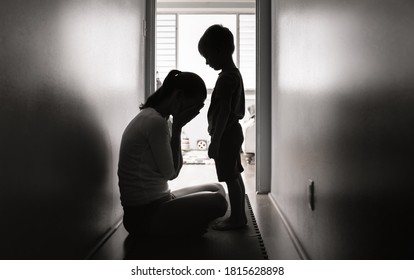 Mother crying next to her child. Family divorce, death and hardship concept.  - Shutterstock ID 1815628898