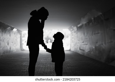 Mother Crying Next To Her Child. Family Divorce, Death And Hardship, Hopelessnes Concept.