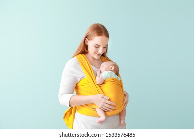 Mother With Cute Baby On Color Background