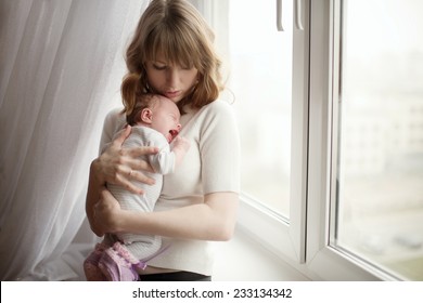 mother with cute little crying baby