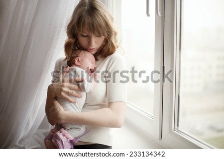 mother with cute little crying baby