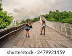 Mother and daughter along Henderson Waves Bridge in Singapore.