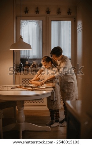 mother and daughter baking christmas cookies