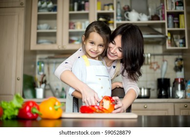 Mother And Daughter Cooking