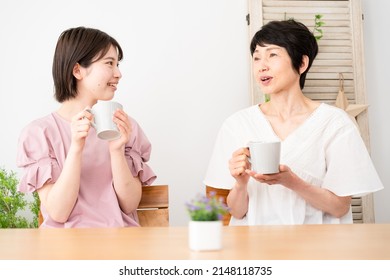 Mother and daughter discussing amicably - Shutterstock ID 2148118735