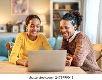 Mother and daughter doing homework with laptop at home. Mom and teenage girl happy using laptop. Teen girl and mum sitting at home working with notebook - Powered by Shutterstock