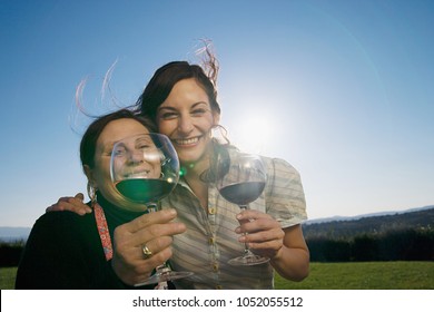 Mother And Daughter Drinking Wine