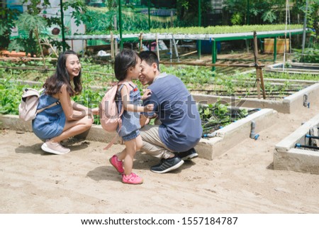 Mother and daughter engaged in gardening together