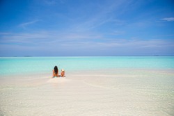 Mother and daughter enjoying time at featuring beach, mother, and child ...