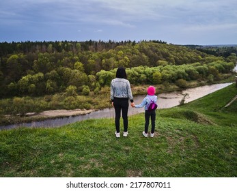 Mother And Daughter Enjoys The View On The Coast Sluch River