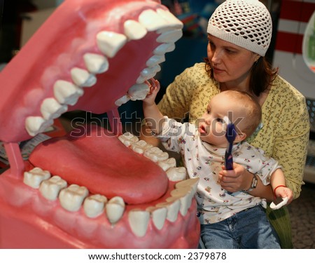 mother and daughter exploring teeth in children museum