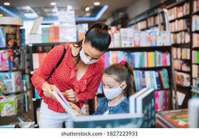 Mother And Daughter With Face Mask Shopping In Bookshop, Coronavirus Concept.