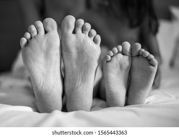 Mother Daughter Feet Bed Stock Photo (Edit Now) 1565443363