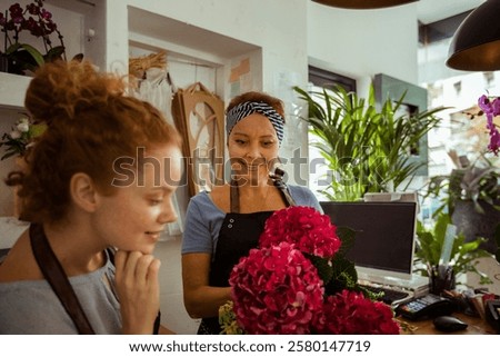 Similar – Image, Stock Photo Woman prepares a bouquet of red roses