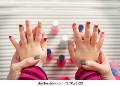 Mother And Daughter Having Fun Painting Fingernails, Family Time Concept, View From Above