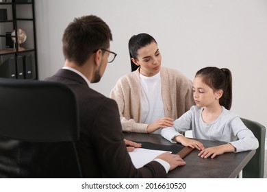 Mother And Daughter Having Meeting With Principal At School