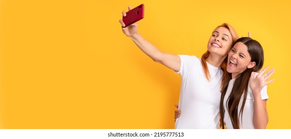 Mother And Daughter Kid Banner, Copy Space, Isolated Background. Happy Funny Family Of Mother Woman And Child Girl Making Selfie On Smartphone, Live Streaming.