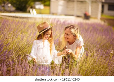 Mother and daughter  in lavender field. 