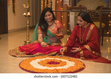 Mother And Daughter In Law Decorating Home In Festival